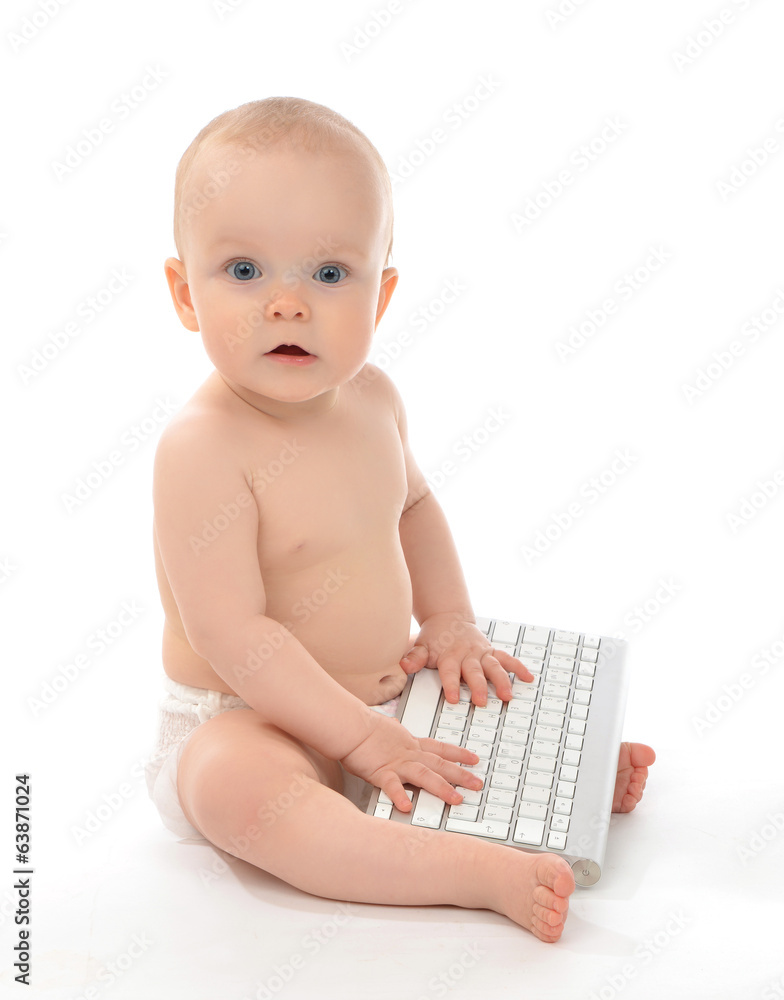 Child baby boy typing on computer keyboard Child baby boy typing on computer keyboard