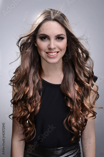 Beautiful young woman with ...