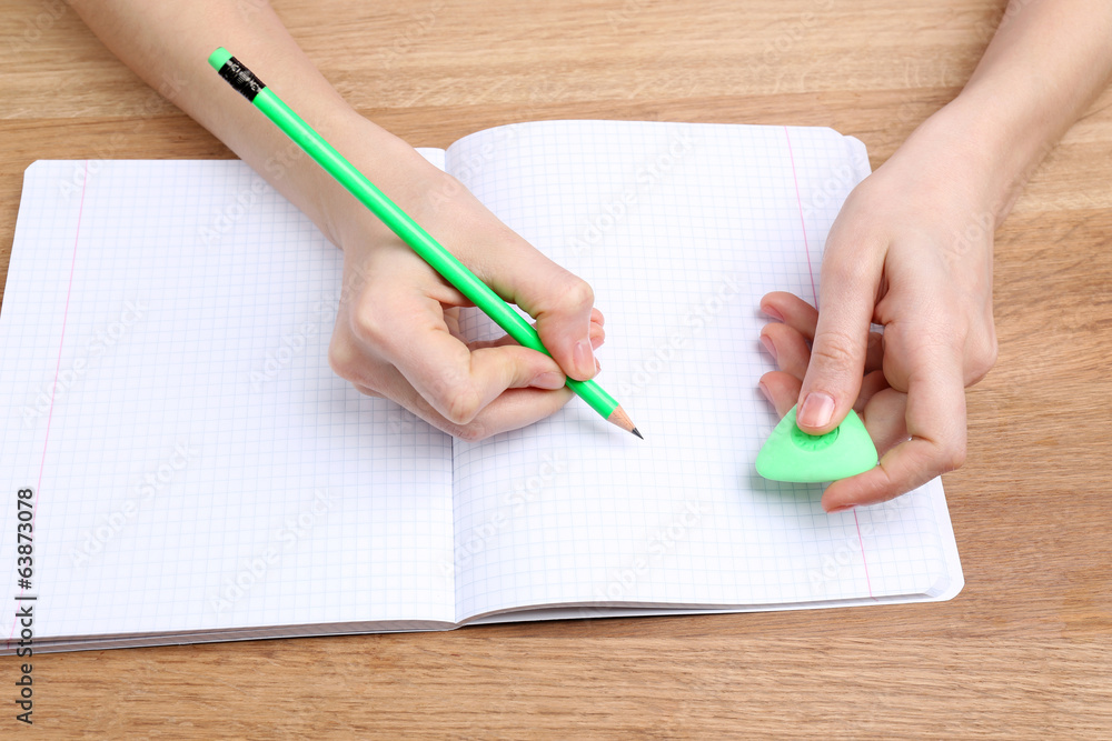 Human hands with pencil writing Human hands with pencil writing