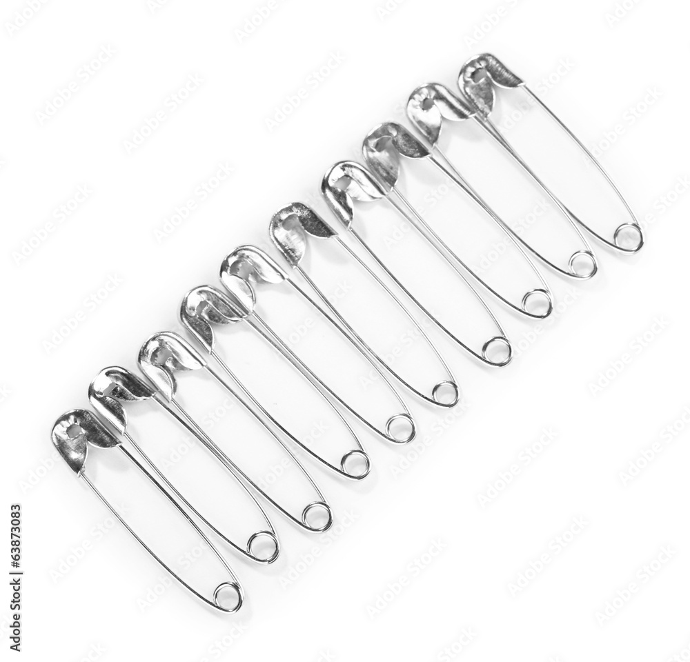 Safety pins isolated on white Safety pins isolated on white