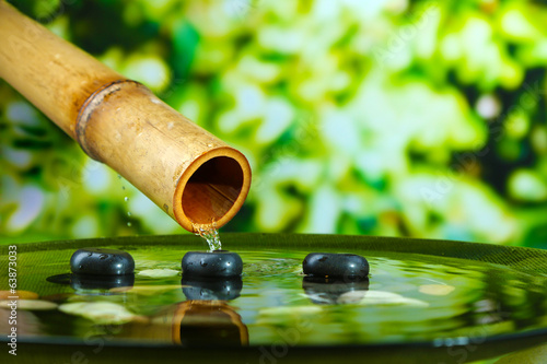 Spa still life with bamboo fountain  on bright background