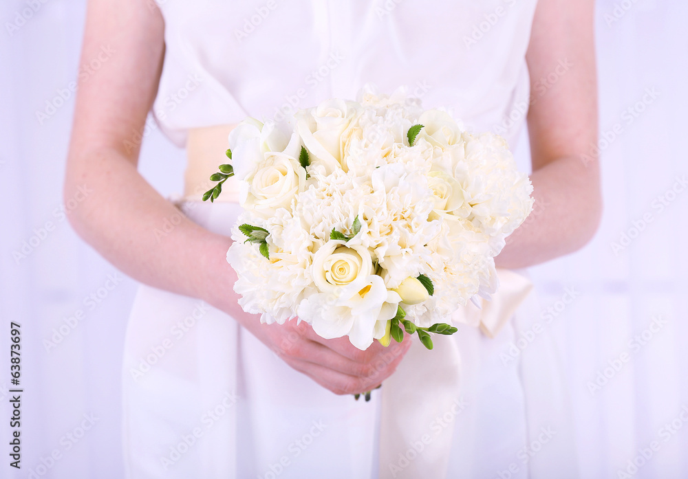 Woman hands holding beautiful wedding bouquet Woman hands holding beautiful wedding bouquet