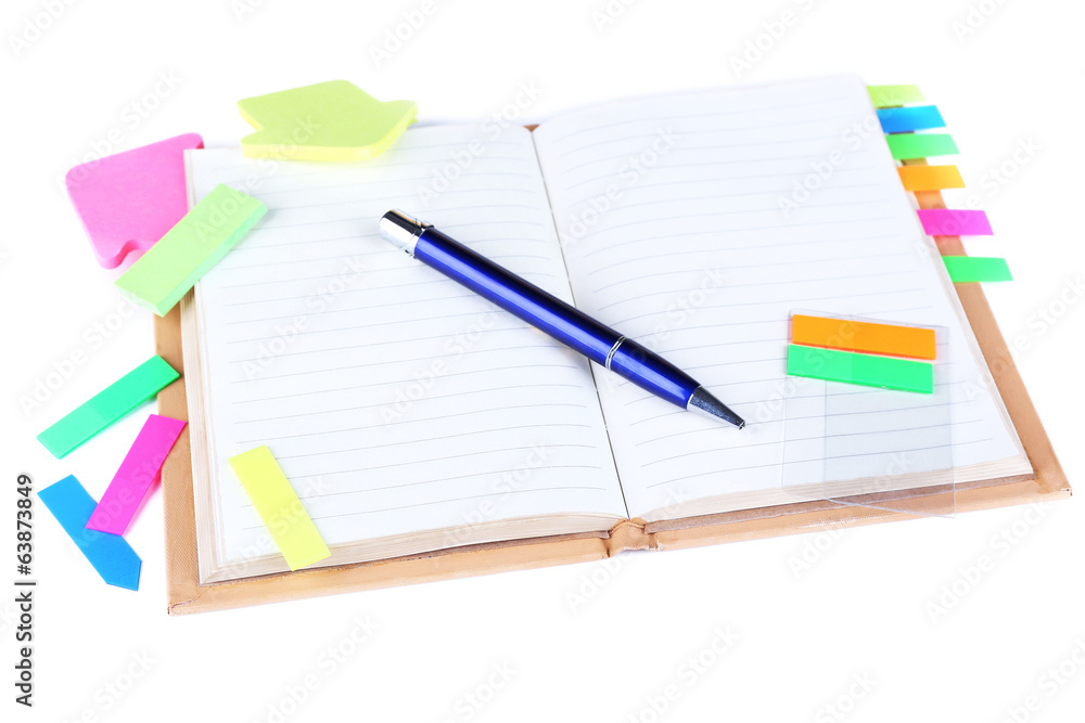 Notebook, pen, and stickers isolated on white Notebook, pen, and stickers isolated on white