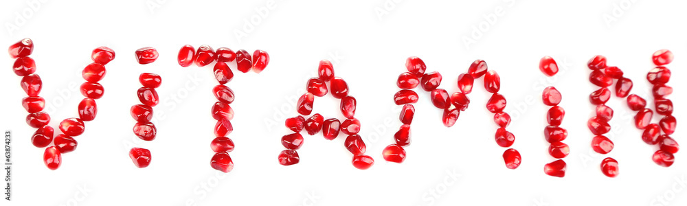 Vitamins sign made of pomegranate seeds, isolated on white Vitamins sign made of pomegranate seeds, isolated on white