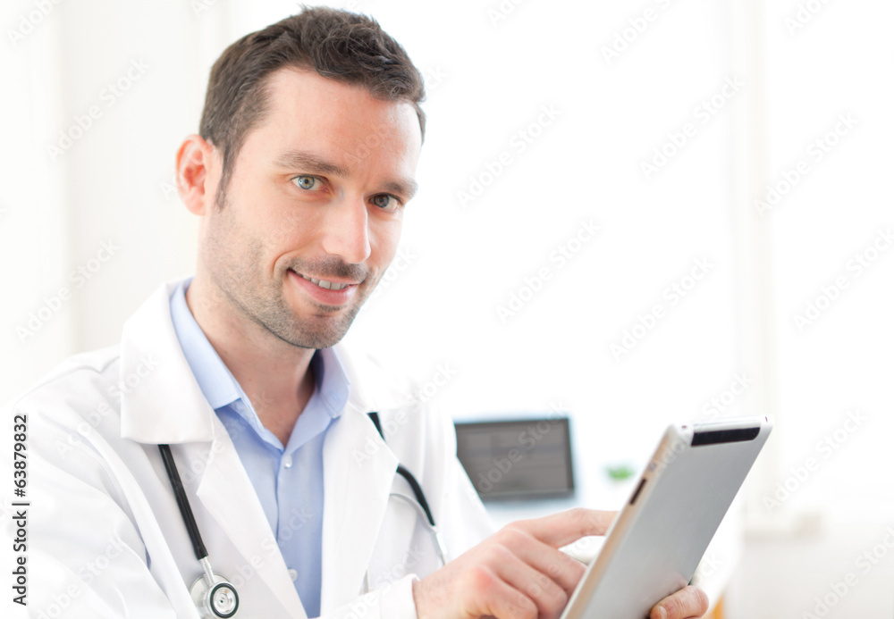Portrait of a young doctor using tablet at work Portrait of a young doctor using tablet at work