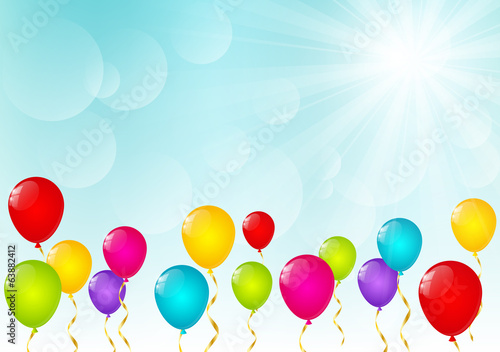 Color balloons on sunny background