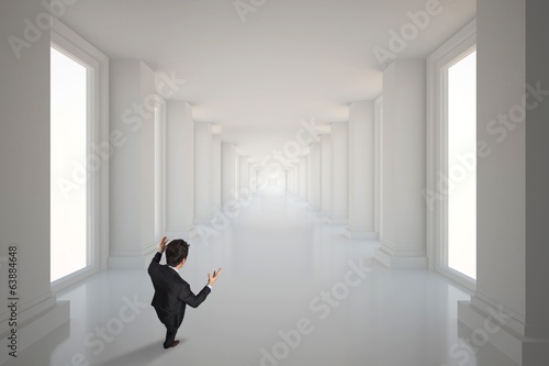 Composite image of gesturing businessman