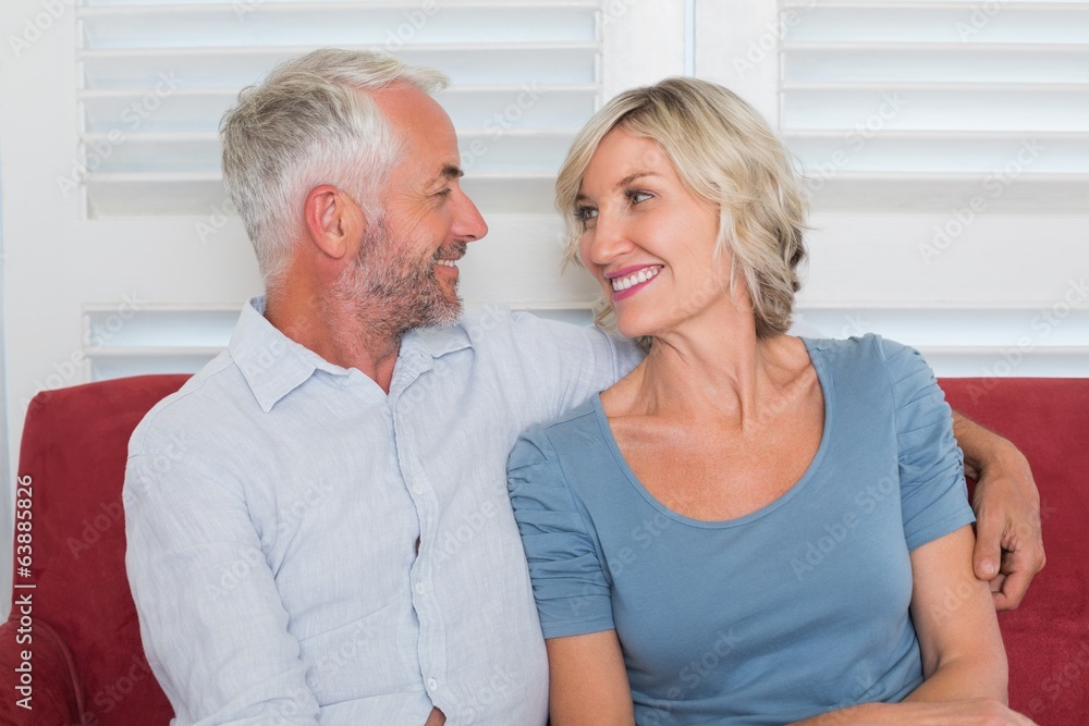 Relaxed mature couple sitting on couch Relaxed mature couple sitting on couch