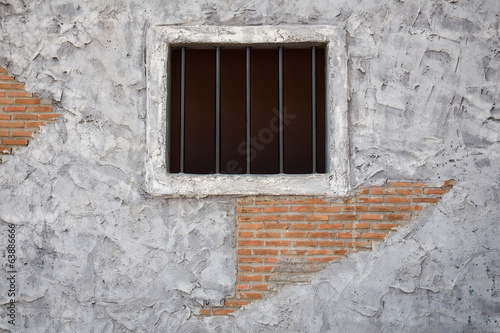 Jail window on Old cement wall