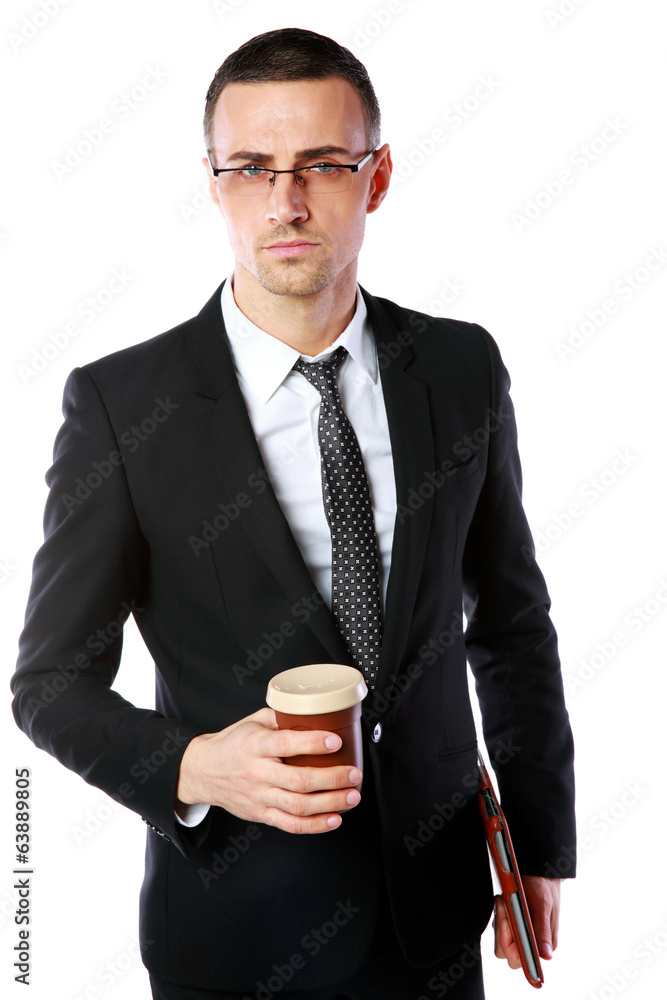 Confident businessman in glasses standing with cup of coffee Confident businessman in glasses standing with cup of coffee