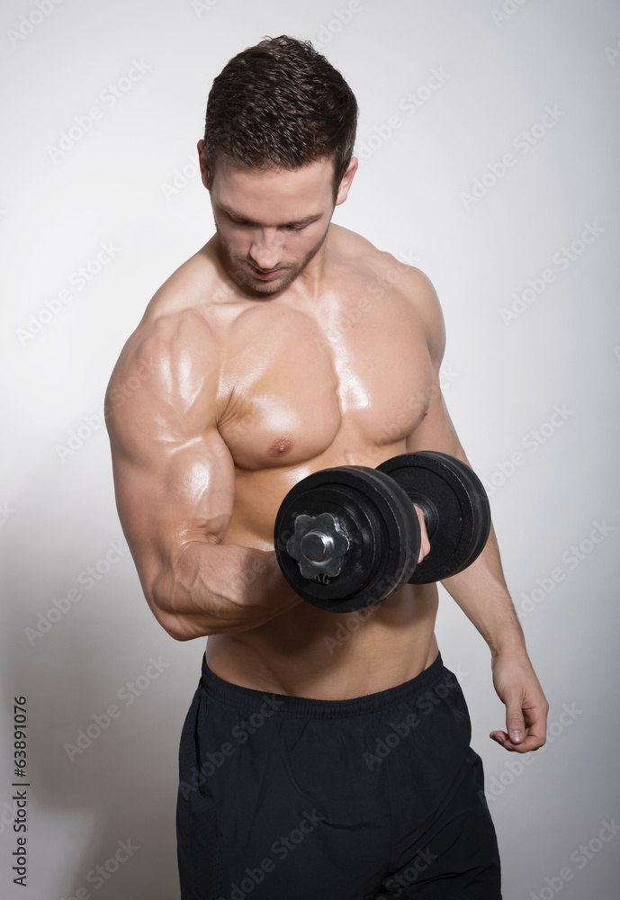 handsome young man with dumbbell