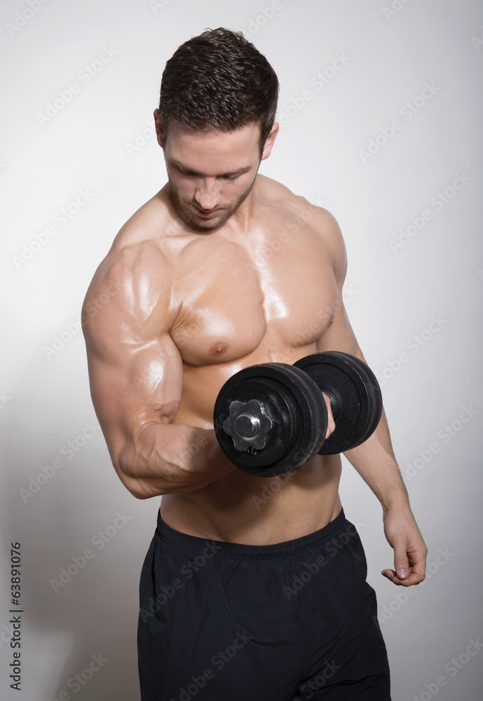 handsome young man with dumbbell handsome young man with dumbbell