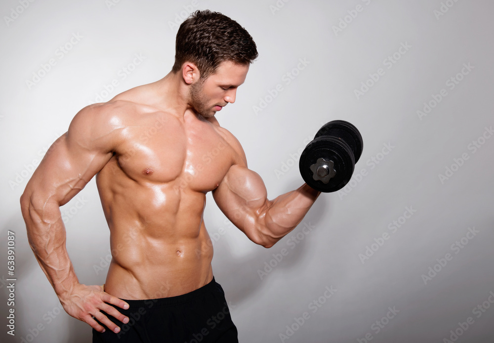 handsome young man with dumbbell
