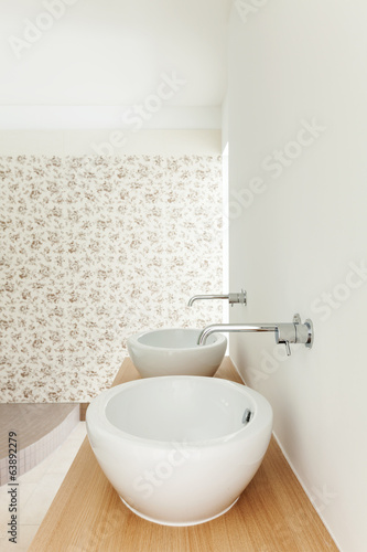Interior of a new empty house, bathroom, sinks view