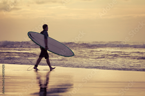 Canvas Print surfer silhouette during sunset