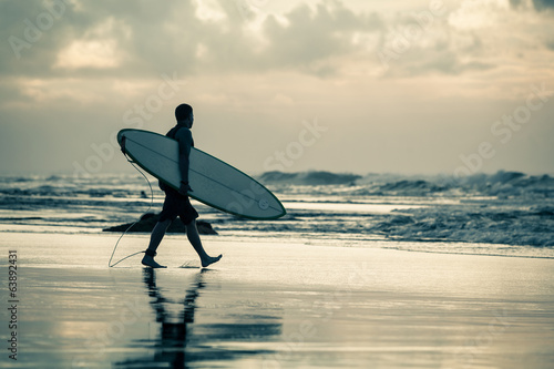 Canvas Print surfer silhouette during sunset