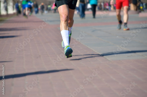 Marathon running race, people feet on road © Iuliia Sokolovska