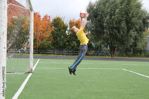 Athletic boy on the football field