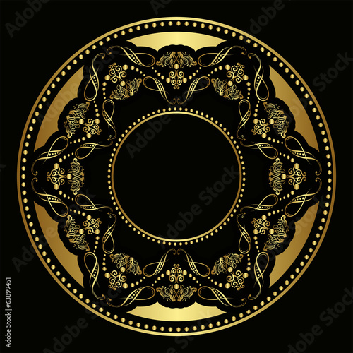 Golden plate with vintage ornament on black background