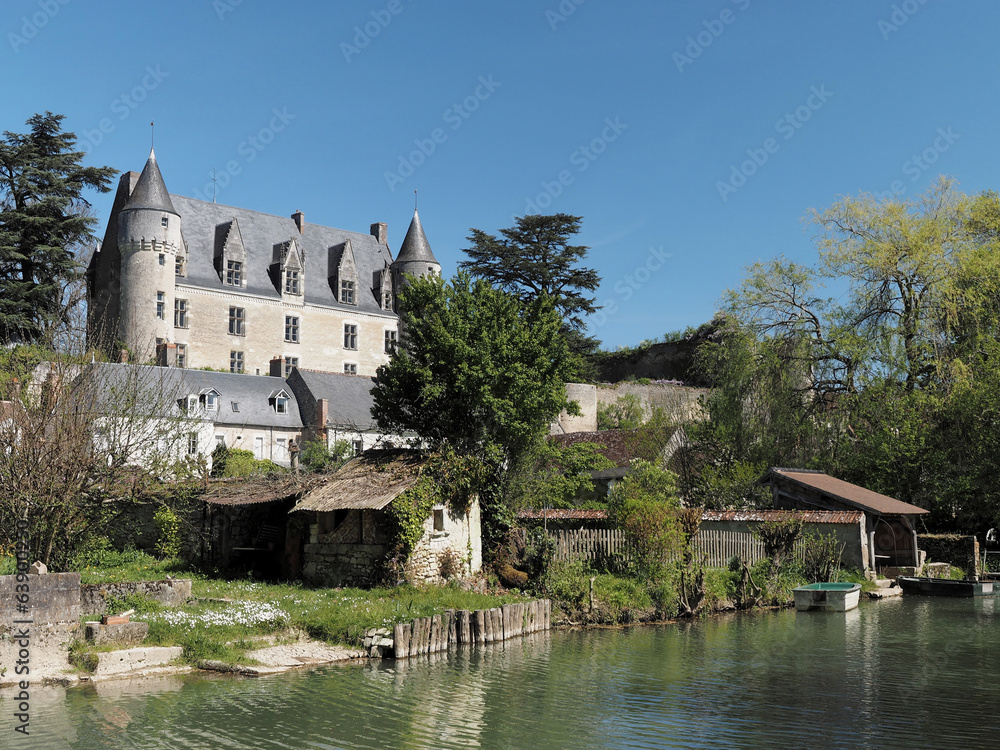 Montresor village and castle seen from the Indrois river, France Montresor village and castle seen from the Indrois river, France