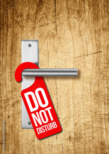 Hotel door with sign do not disturb