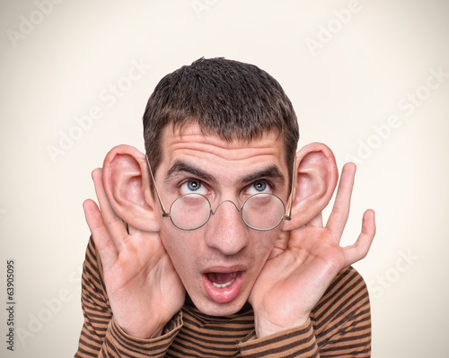 Man listening with big ears.