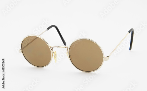 Retro round sunglasses on white background photo
