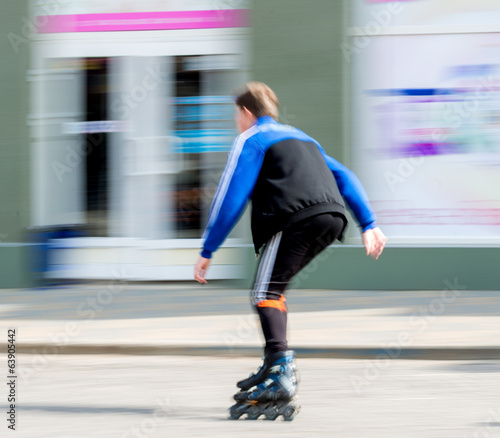 Young man on rollerblades