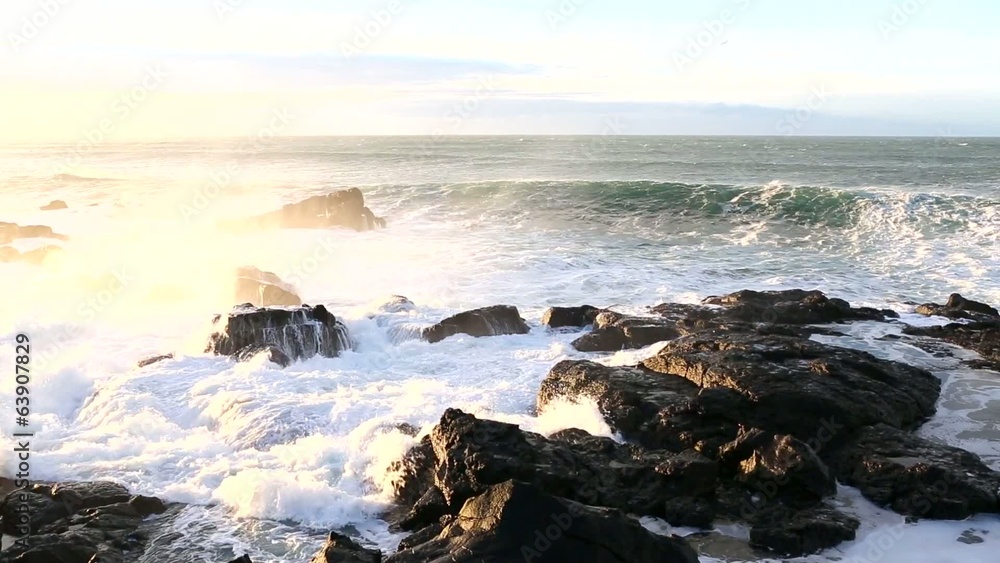 Strong sea surf in the rays of the rising sun Strong sea surf in the rays of the rising sun