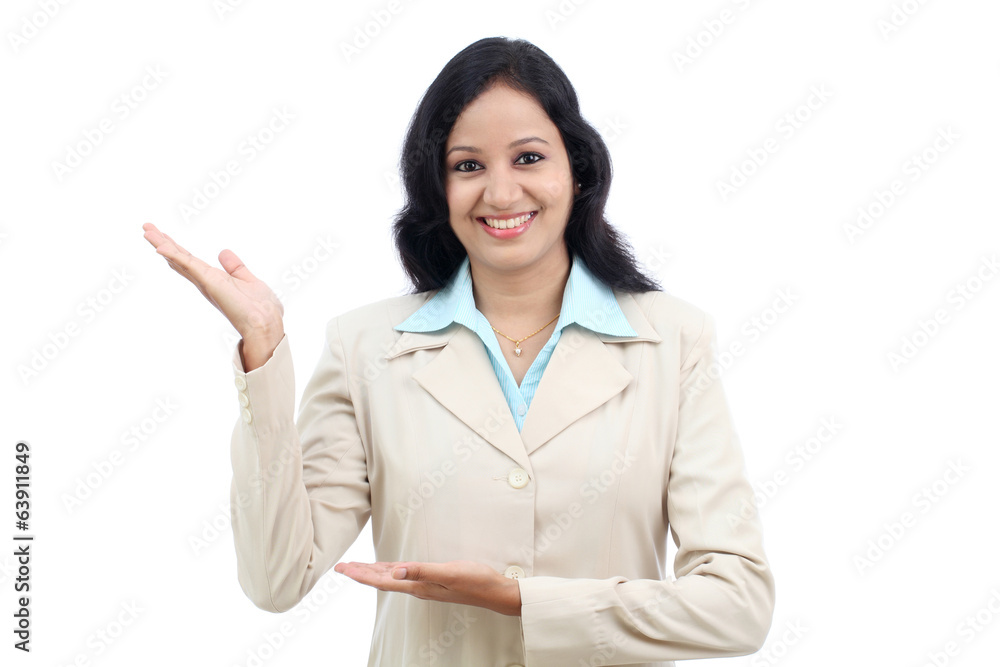 Happy young business woman presenting a copy space against white Happy young business woman presenting a copy space against white