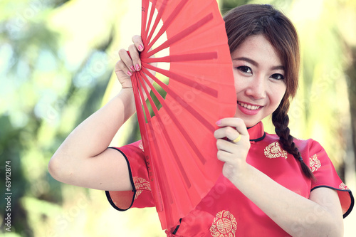 Chinese girl with dress traditional Cheongsam