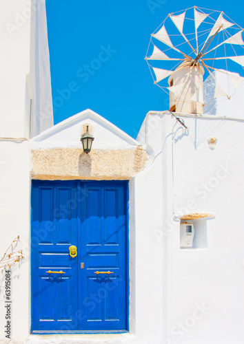 wooden coloured door of a house in Amorgos island in Greece.