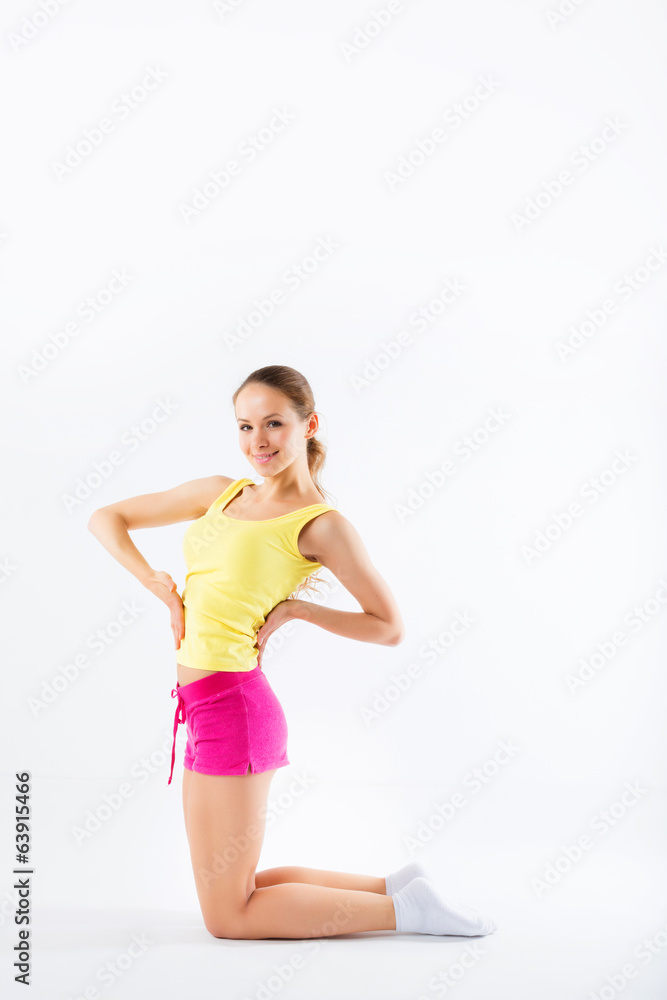 Young woman doing aerobics and stretching, isolated on white bac Young woman doing aerobics and stretching, isolated on white bac