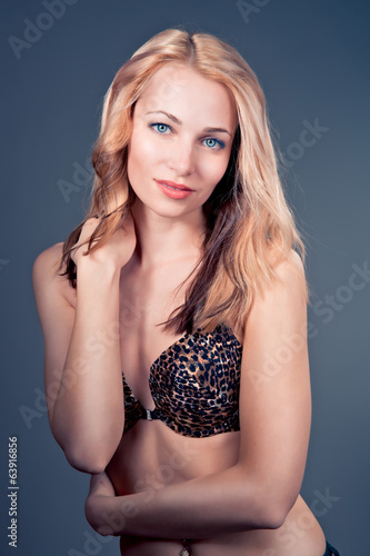 beautiful  blonde female model on blue background