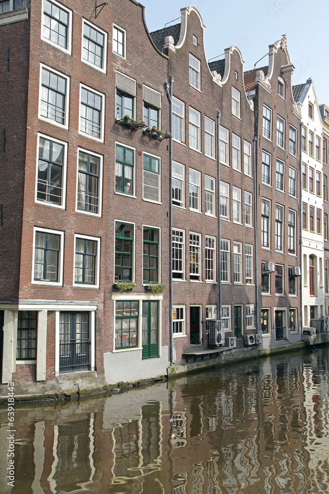 Obraz premium Water canal and typical architecture in Amsterdam, Netherlands