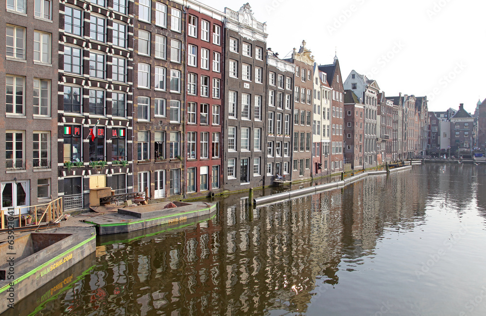 Water canal and typical architecture in Amsterdam, Netherlands Water canal and typical architecture in Amsterdam, Netherlands