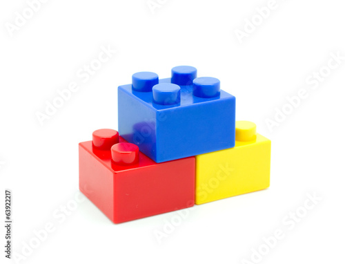 Plastic building blocks on white background