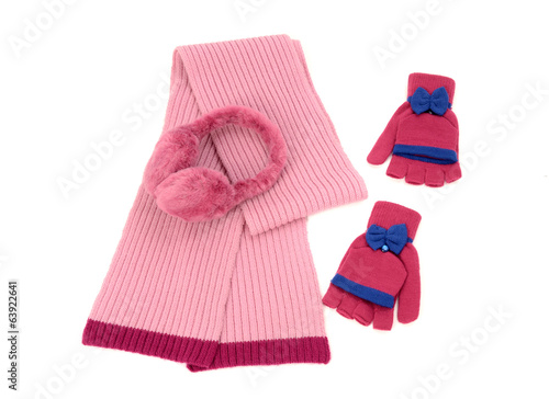 Pink wool scarf,a pair of gloves and earmuffs.Winter accessories