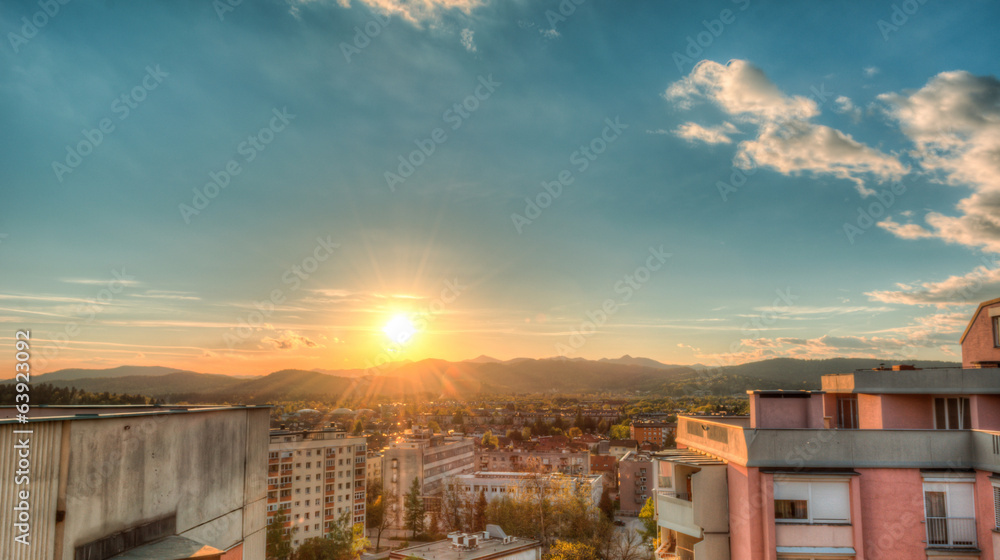 Sunset between two tower blocks with a city view Sunset between two tower blocks with a city view