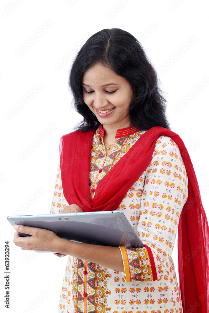 Happy young woman with tablet computer against white Happy young woman with tablet computer against white