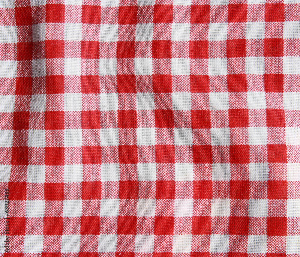 Texture of a red and white checkered picnic blanket. Texture of a red and white checkered picnic blanket.