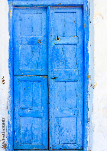 blue colored wooden door in Amorgos island in Greece © imagIN photography