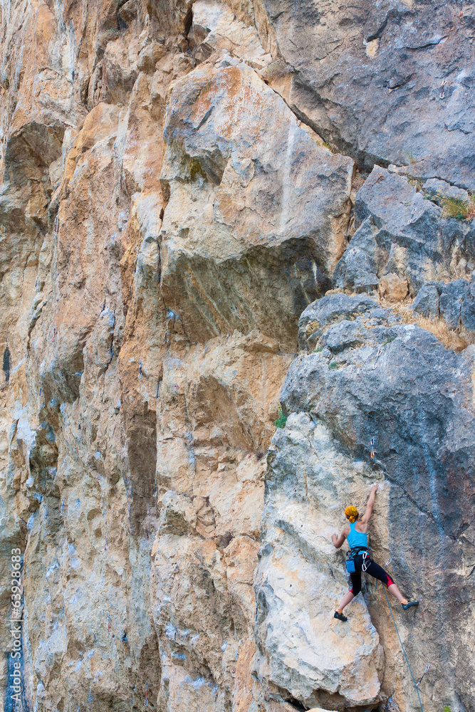Female climber on a rock