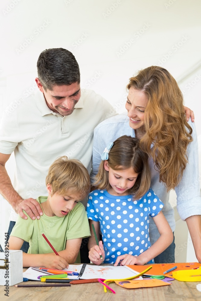 Parents looking at children coloring Parents looking at children coloring