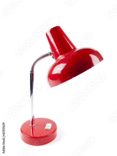 An old vintage red desk lamp with a light bulb