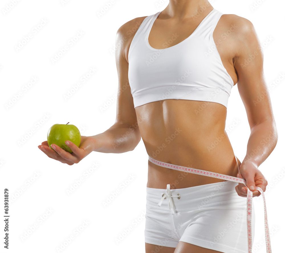 young athletic woman holding a green apple young athletic woman holding a green apple