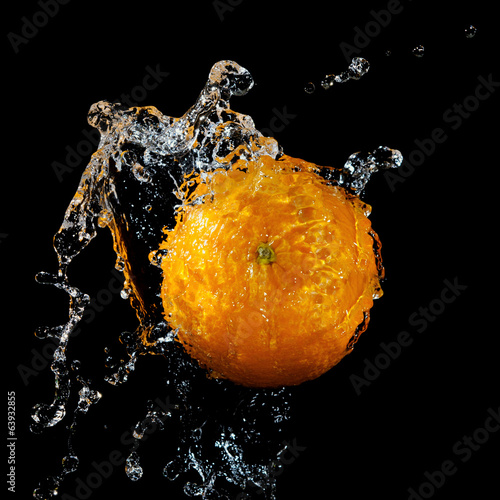 Fresh orange in water splash