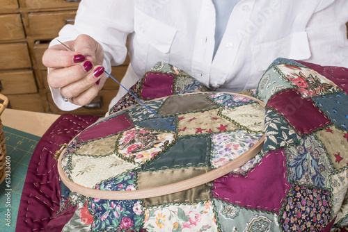 Mature woman by sewing and quilting photo