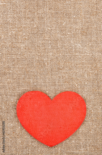 Felt red heart on the burlap