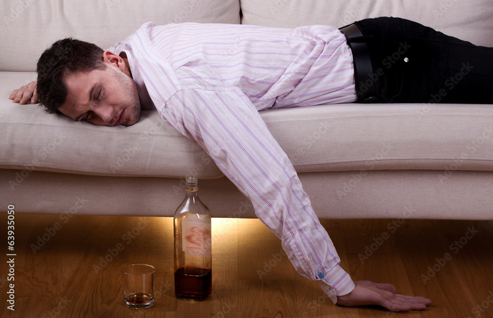Drunk man sleeping on the sofa Drunk man sleeping on the sofa